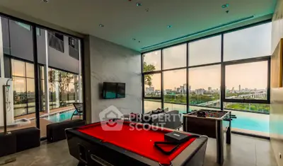 Luxurious living room with pool table and stunning city view in modern apartment