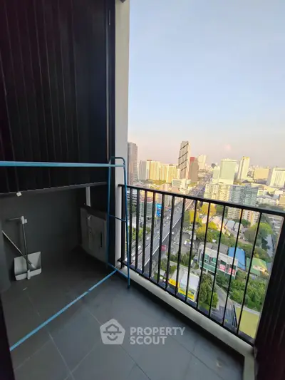 High-rise balcony with stunning cityscape view and modern railing