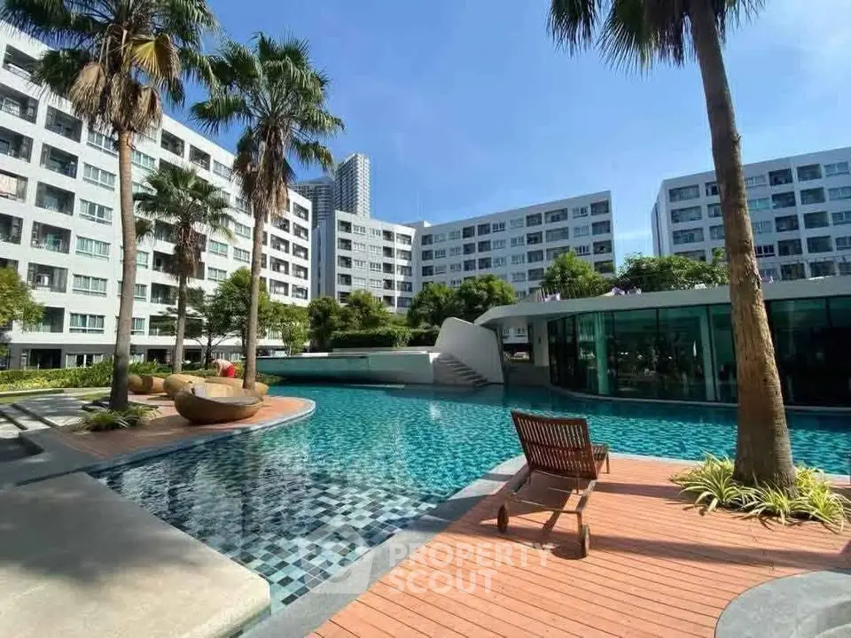Luxurious apartment complex with stunning pool and lush landscaping