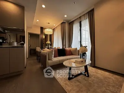 Elegant living room with modern decor and large windows in a luxury apartment.