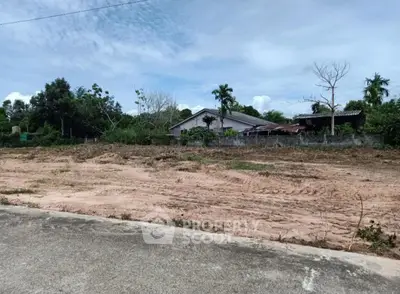 Vacant land plot with potential for development in a serene neighborhood setting.