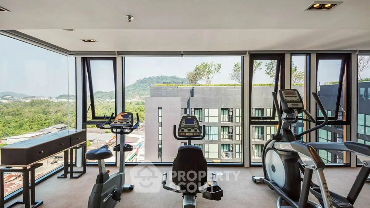 Modern gym with panoramic views in luxury apartment building