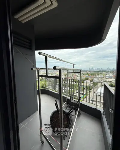 Spacious balcony with city view, perfect for relaxation and enjoying the skyline.