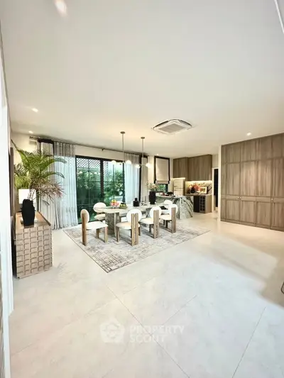 Luxurious open-plan living room with modern dining area and elegant decor