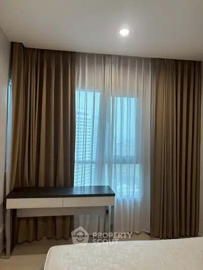 Modern bedroom with elegant curtains and sleek furniture