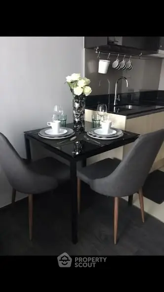 Modern kitchen with sleek dining setup and elegant decor