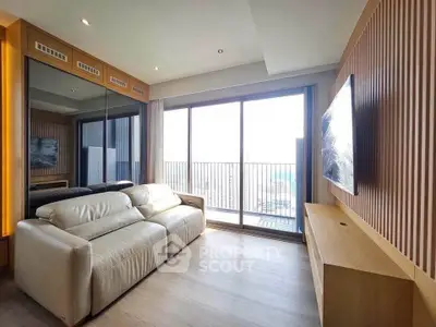 Modern living room with large windows and city view, featuring sleek furniture and elegant design.