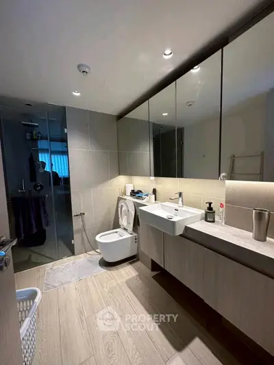Modern bathroom with sleek fixtures and spacious shower area