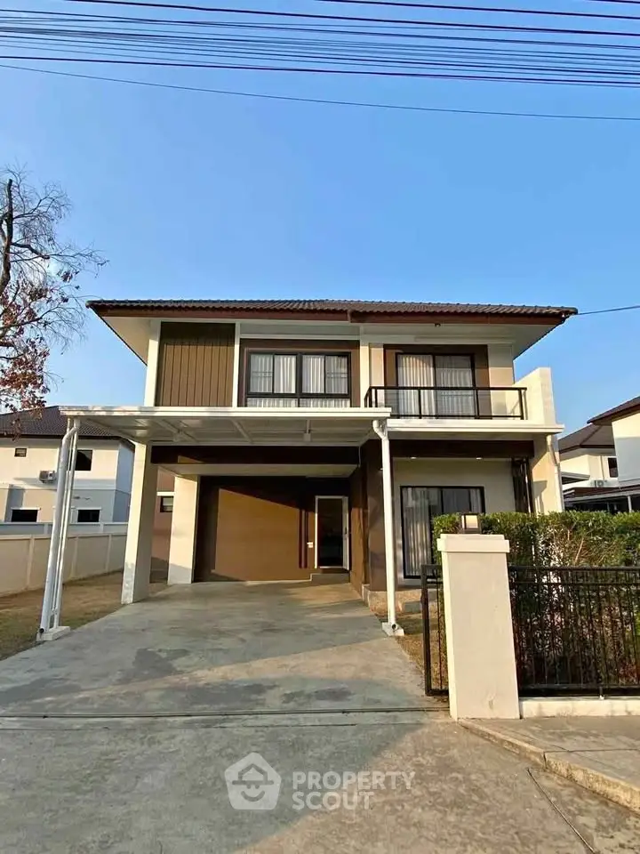 Charming two-story house with spacious driveway and modern exterior design, perfect for family living.