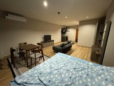 Spacious open-plan living area with modern furnishings and cozy ambiance.
