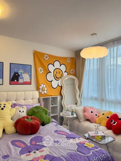 Charming bedroom with playful decor and cozy ambiance, featuring plush toys and vibrant wall art.