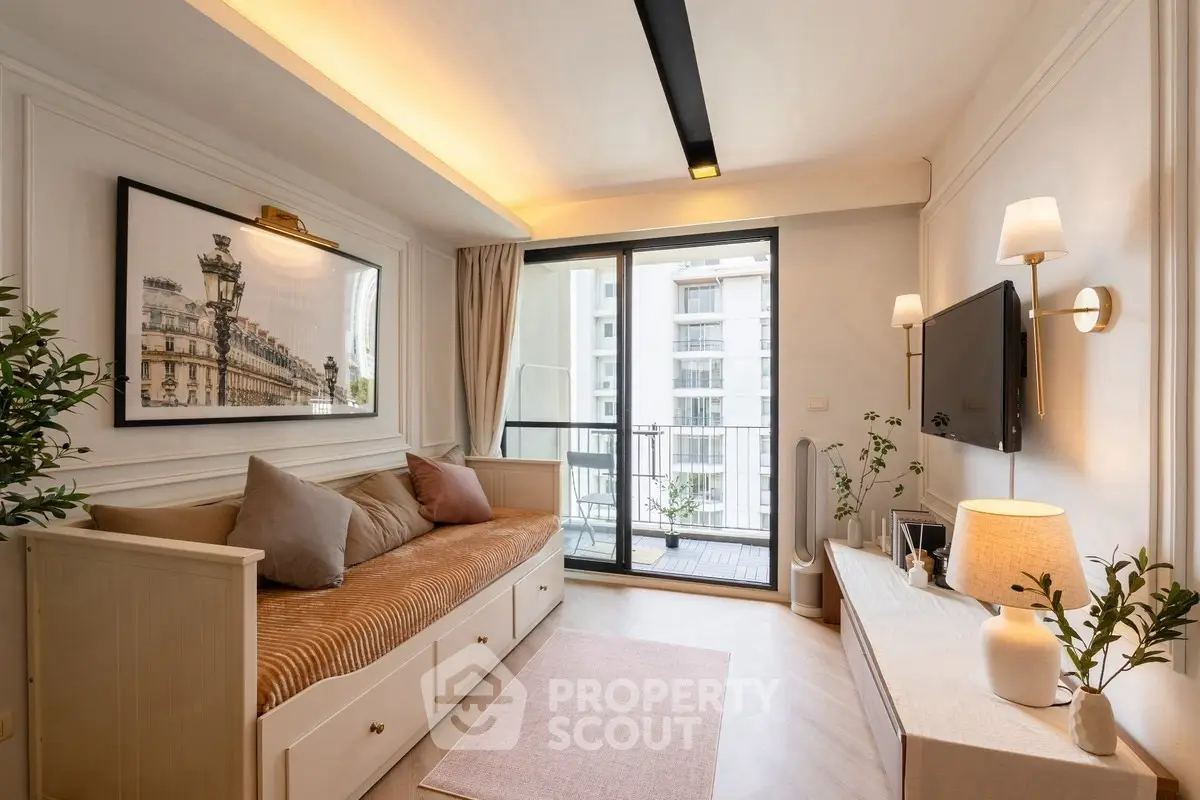 Chic living room with elegant decor and balcony access in modern apartment.