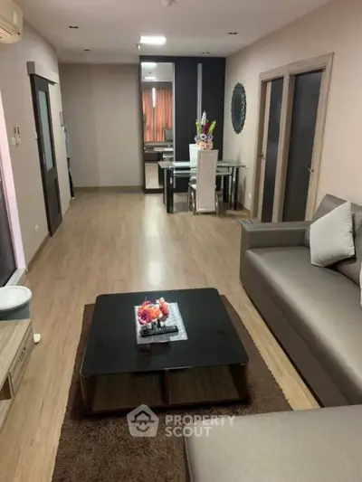 Spacious modern living room with elegant decor and dining area