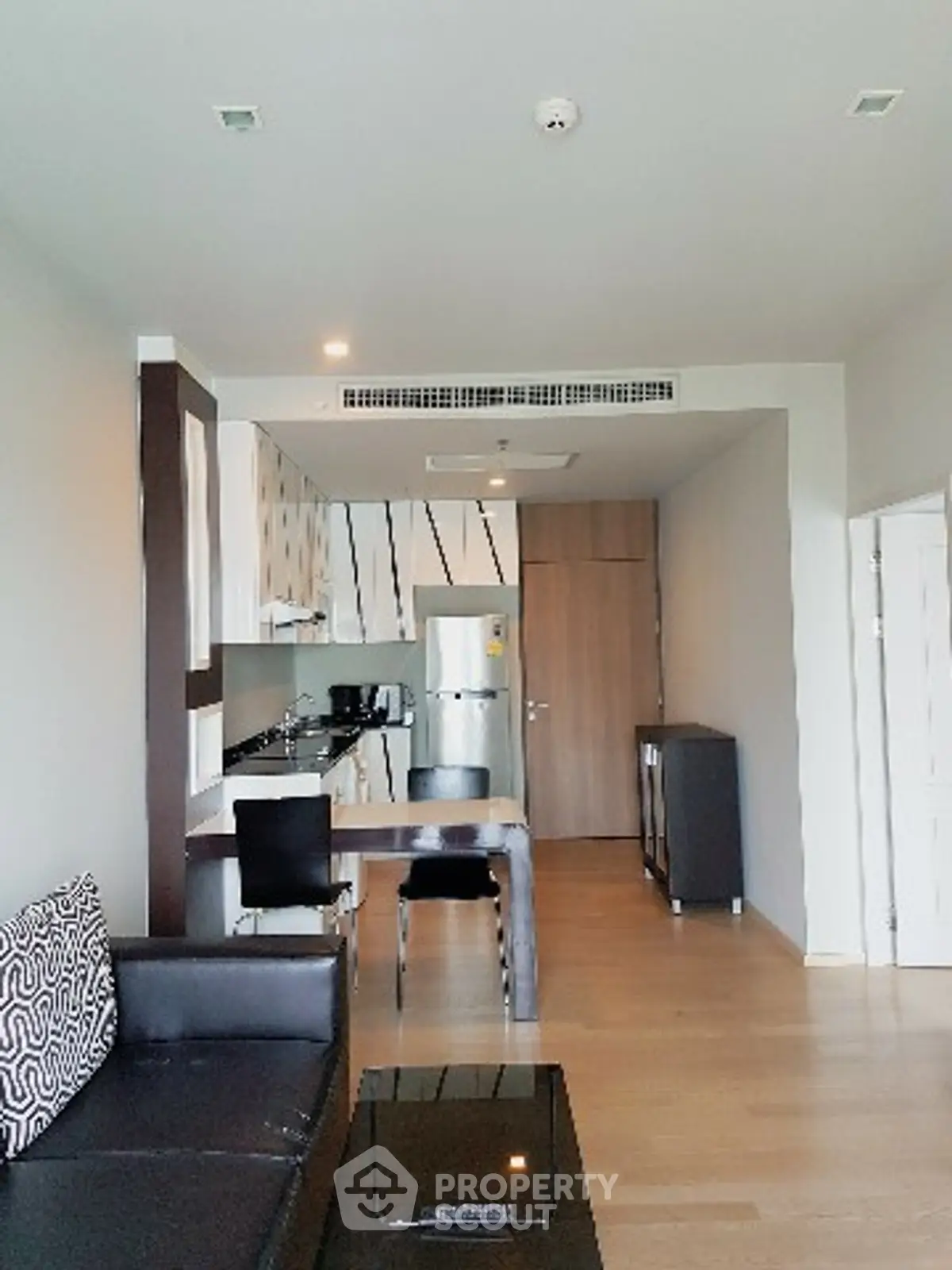 Modern apartment interior with sleek kitchen and stylish living area