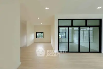 Spacious modern interior with large glass doors and natural light