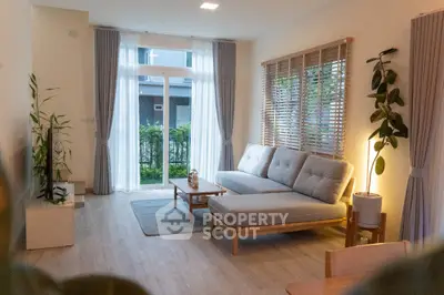 Modern living room with large windows and stylish furniture