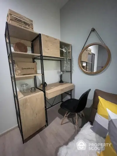 Modern study nook with stylish shelving and cozy chair in a chic apartment