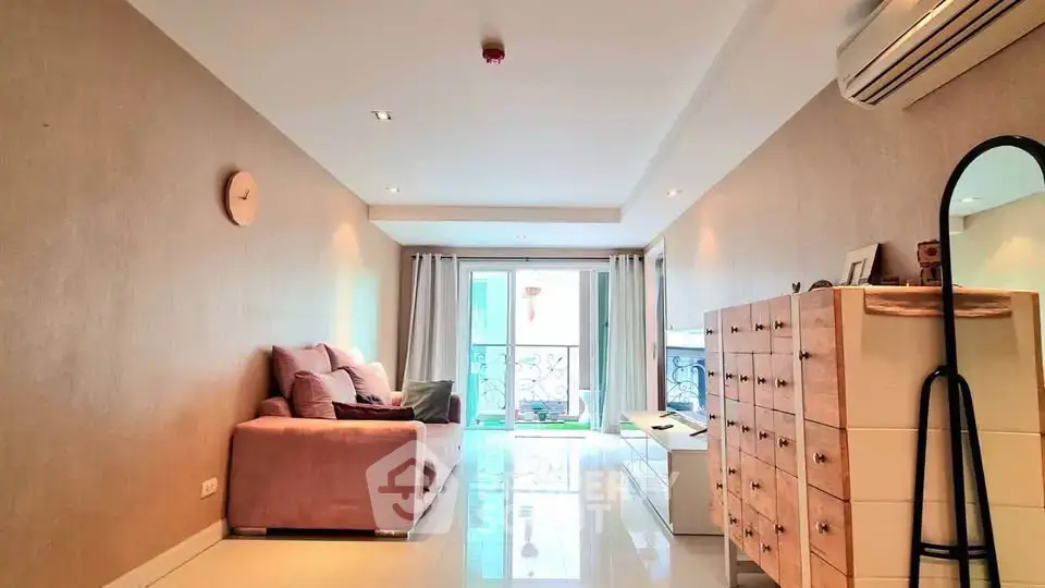 Spacious living room with modern decor and natural light