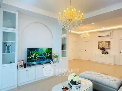 Luxurious living room with elegant chandeliers and modern decor