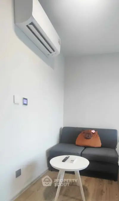 Cozy living room with modern air conditioning and stylish sofa