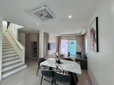 Modern living room with elegant dining area and stylish decor