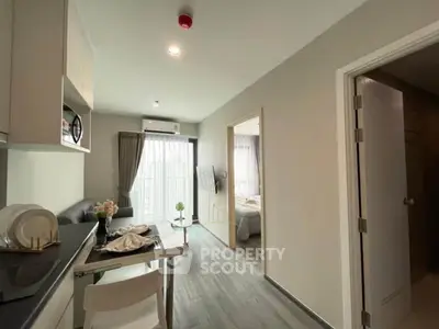 Modern apartment interior with open kitchen and cozy living area