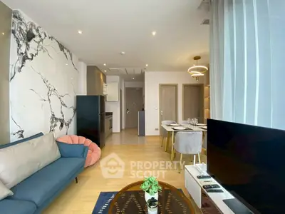 Modern living room with stylish decor and open dining area