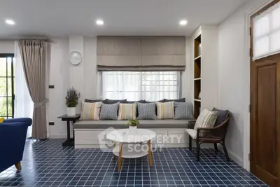 Charming living room with cozy seating and stylish decor, perfect for relaxation and entertaining.