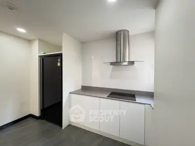 Modern kitchen with sleek cabinetry and stainless steel appliances