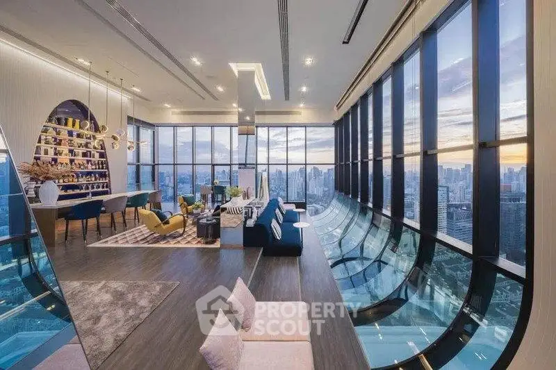 Luxurious high-rise living room with panoramic city views and modern decor