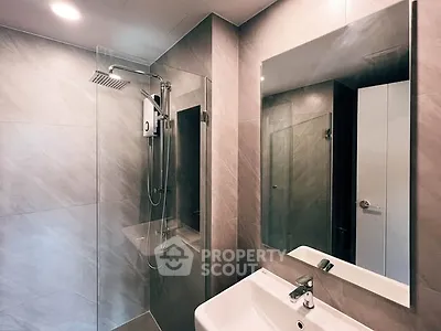 Modern bathroom with sleek shower and elegant mirror design