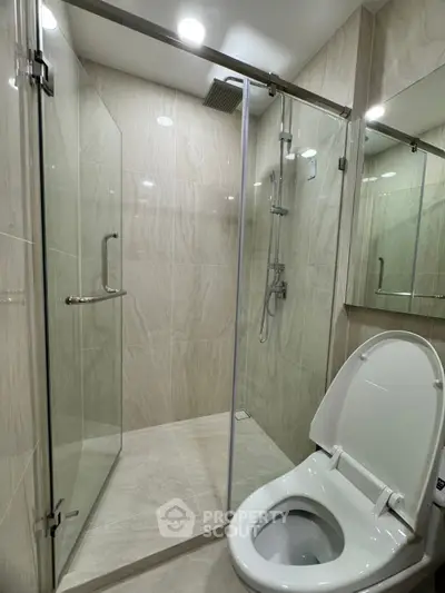 Modern bathroom with glass shower enclosure and sleek design