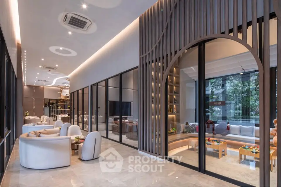 Luxurious modern living room with elegant seating and large windows offering garden views.