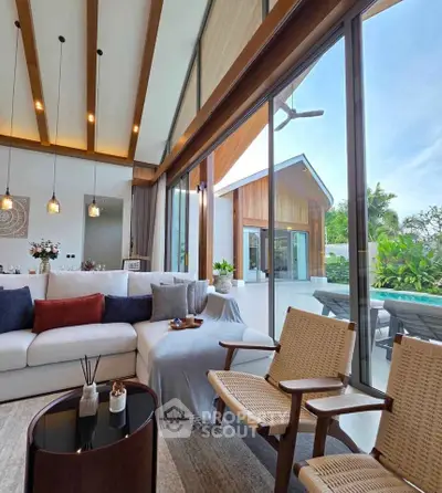 Luxurious living room with floor-to-ceiling windows and pool view