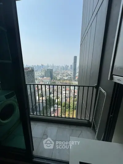 Stunning high-rise balcony view overlooking city skyline, perfect for urban living.