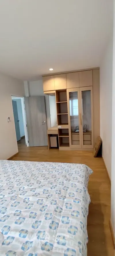 Spacious bedroom with built-in wardrobe and modern decor