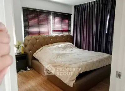 Cozy bedroom with elegant curtains and stylish bed frame