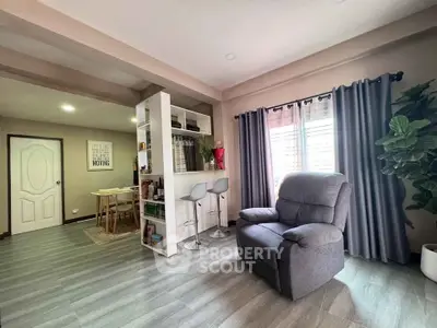 Modern living room with cozy armchair and stylish decor