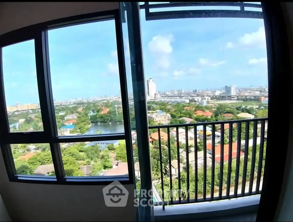 Stunning high-rise apartment with panoramic city views and spacious balcony.