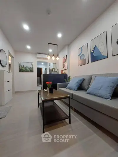 Modern living room with stylish decor and comfortable seating in a cozy apartment.