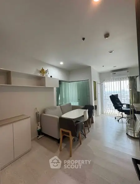 Modern living room with stylish furniture and natural light, perfect for urban living.