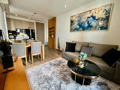 Modern living room with stylish decor and open kitchen layout