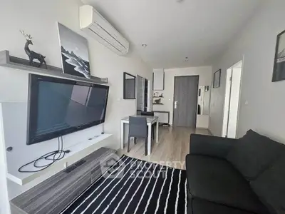 Modern living room with sleek furniture and stylish decor in a contemporary apartment.