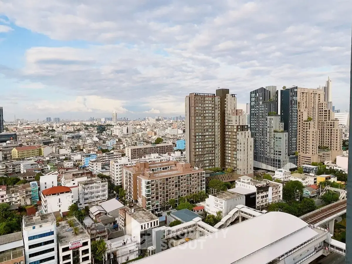 Stunning cityscape view from a high-rise building showcasing urban skyline and architecture.