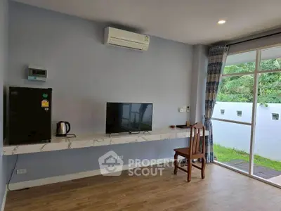 Modern living room with air conditioning and garden view