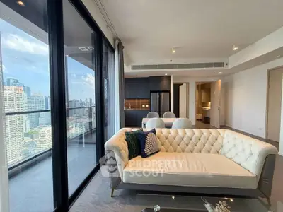Luxurious modern living room with stunning city view and elegant furnishings in high-rise apartment.