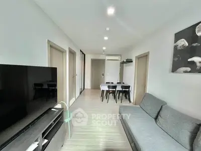 Modern living room with sleek furniture and stylish decor in a contemporary apartment.