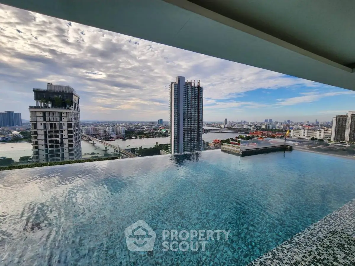 Stunning rooftop infinity pool with breathtaking city skyline view