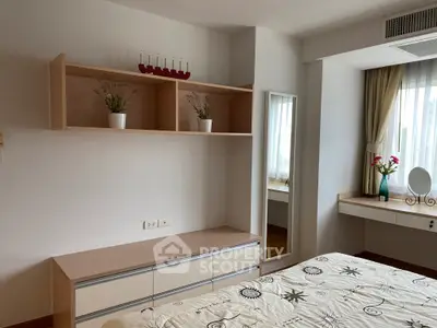 Bright and cozy bedroom with modern decor and ample natural light