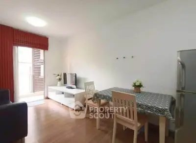 Cozy living room with dining area and balcony access in modern apartment